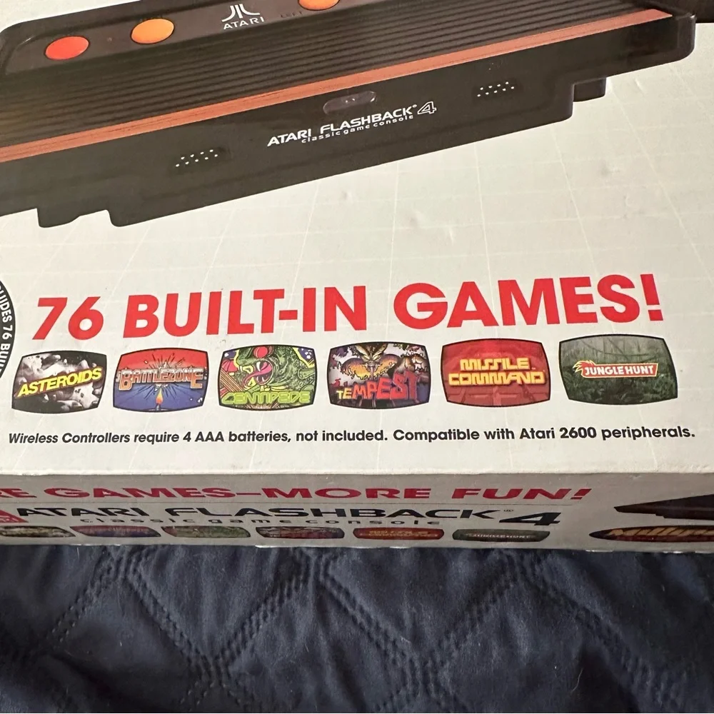 Original in the box, never opened Atari with 76 games.